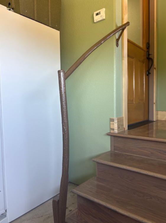 Custom curved metal handrail on staircase